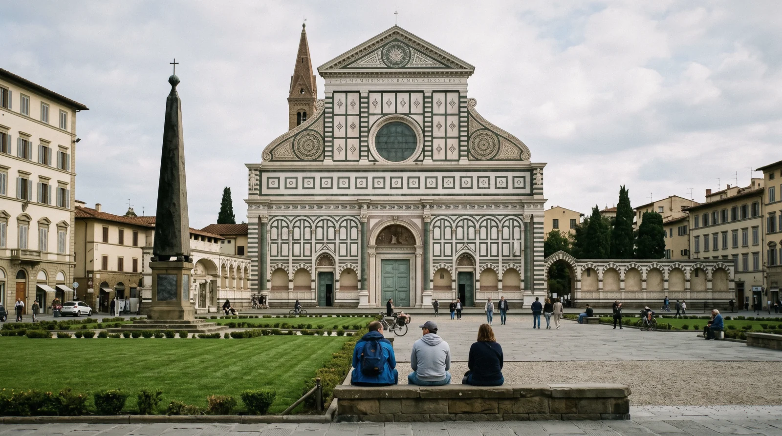 Alberti's green and white marble façade of Santa Maria Novella Florence seen across the piazza in morning light