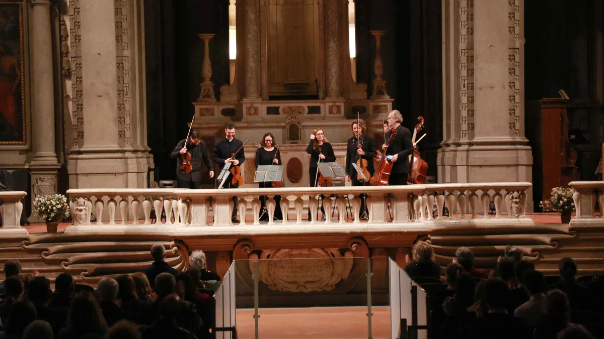 String ensemble playing Vivaldi at an evening classical music concert in Florence, Italy