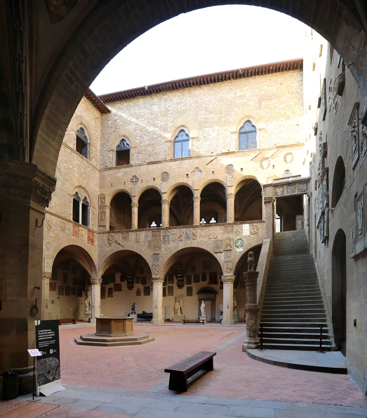 The arcaded courtyard, well and outdoor staircase of the Bargello museum in Florence's historic centre