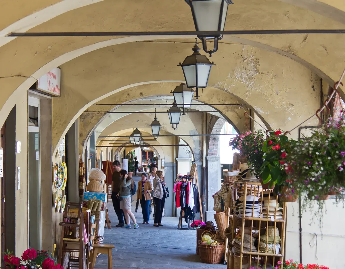 The vaulted arcades of Piazza Matteotti in Greve, the market town on a Chianti day trip from Florence
