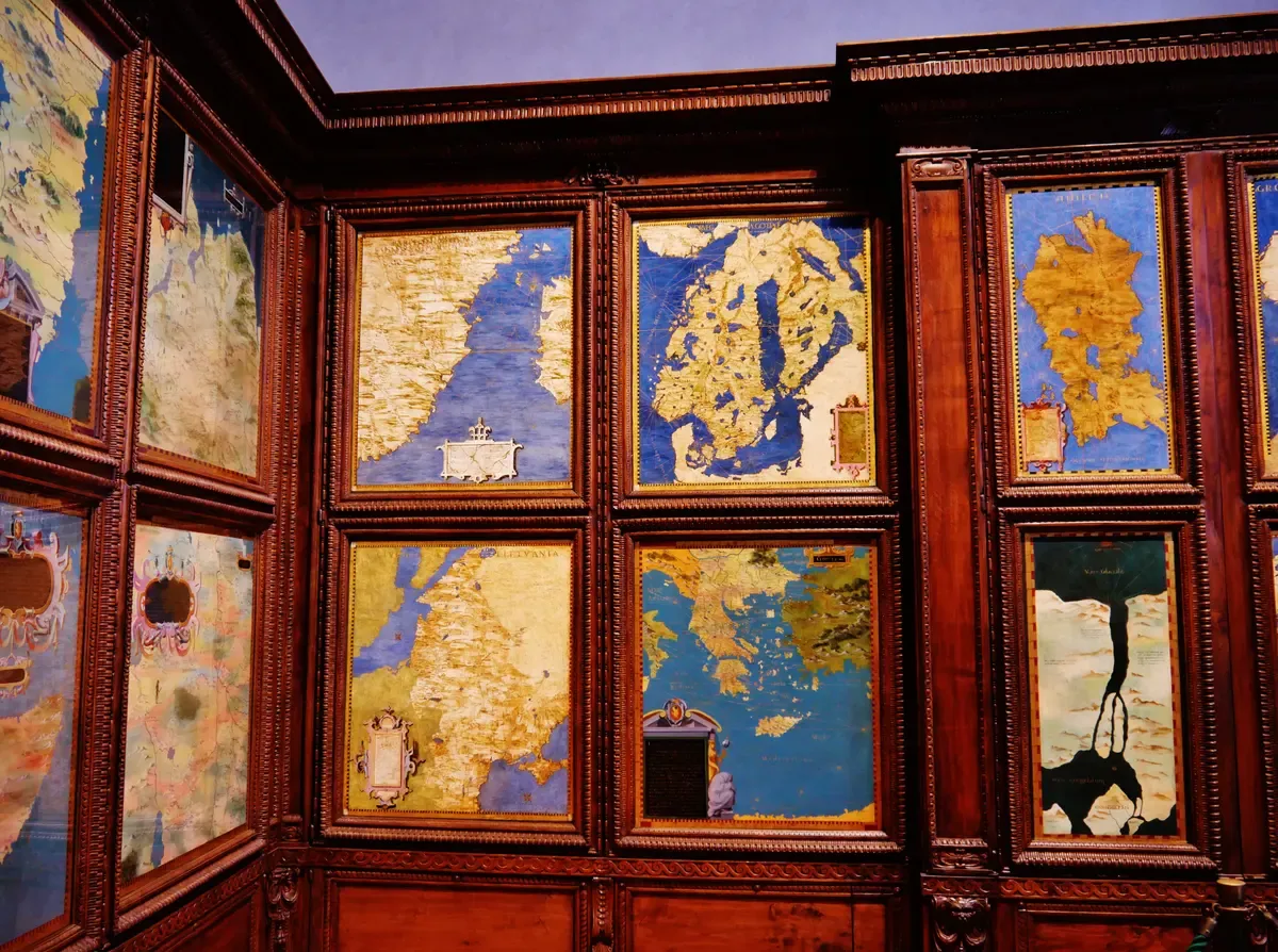 Painted maps on the walnut cabinet doors of the Hall of Geographical Maps inside Palazzo Vecchio, Florence